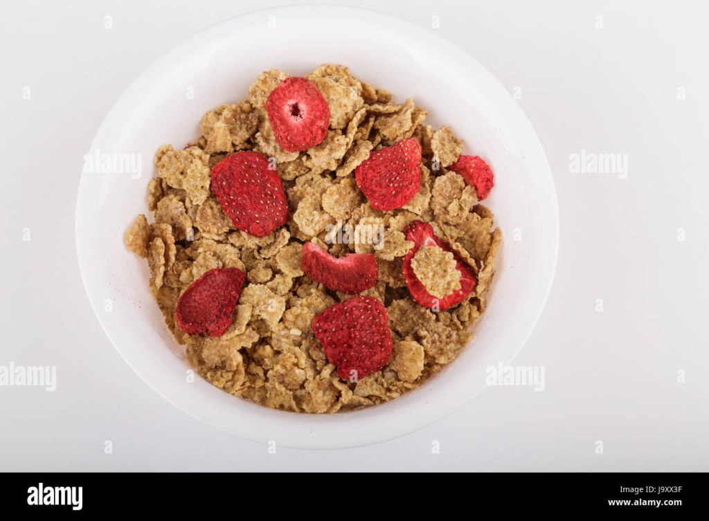 Picture of: A bowl of toasted wheat cereal with freeze dried strawberries