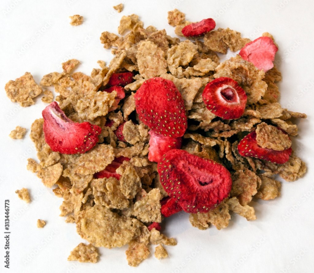 Picture of: Pile of healthy grain cereal with freeze-dried strawberries